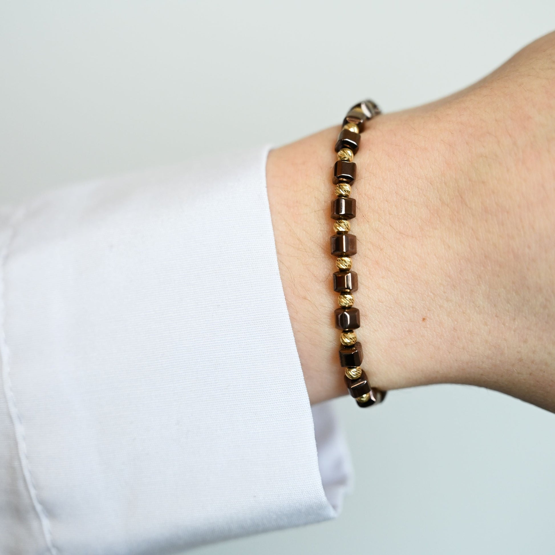 Kralenarmband met gouden accenten en 14 karaat gouden kralen