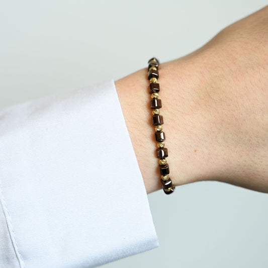 Kralenarmband met gouden accenten en 14 karaat gouden kralen
