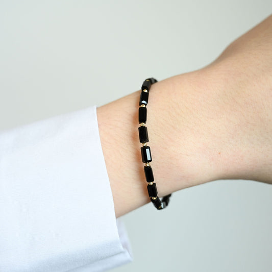 Rebellion Slim Stijlvolle en minimalistische armband met 14 karaat gouden kralen