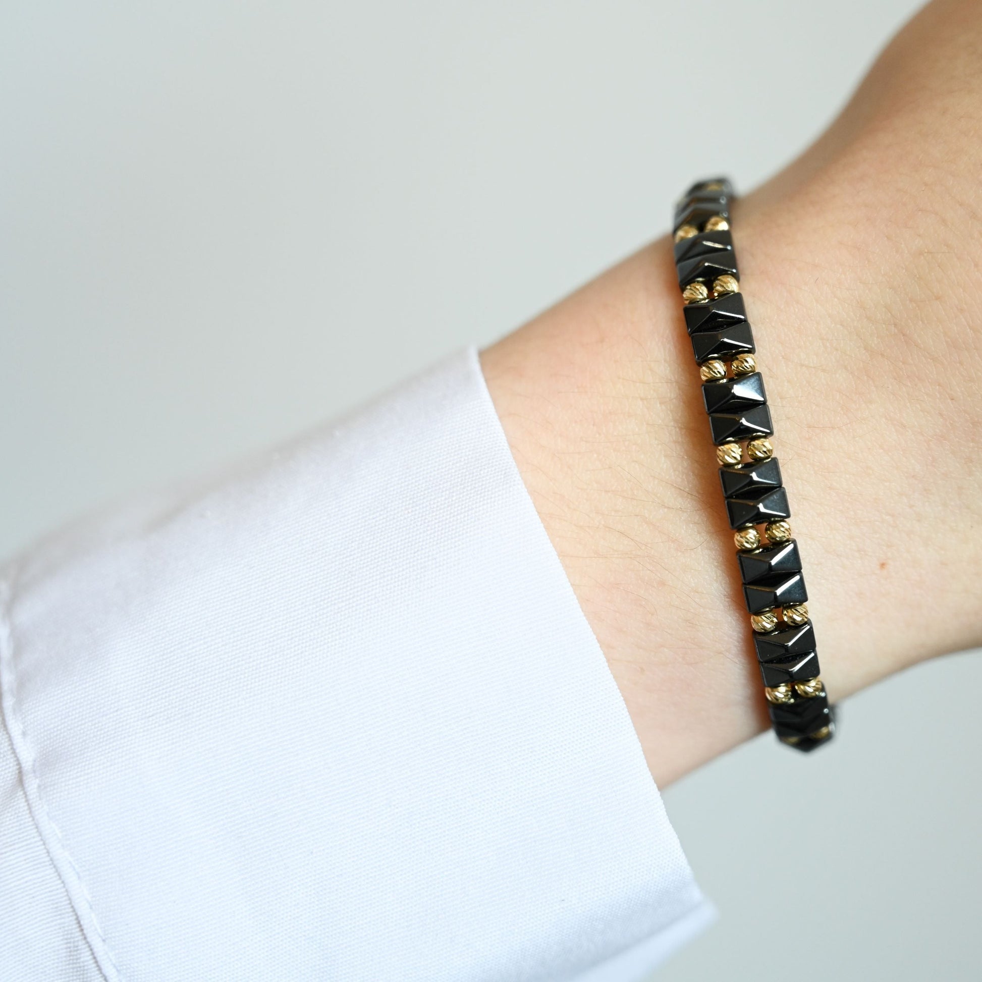 armband met hoogwaardige keramische én 14 karaat gouden kralen